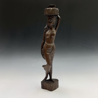 Lot 231 - A West African (Guyana) carved wood sculpture...