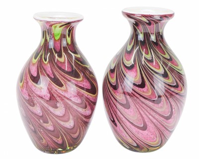 Lot 567 - A pair of heavy art glass swirl vases.