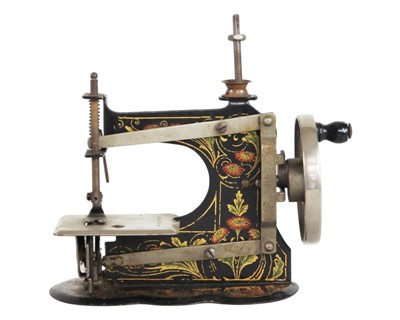 Lot 37 - Two miniature tinplate sewing machines.