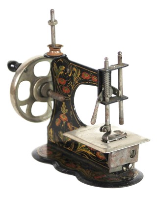 Lot 37 - Two miniature tinplate sewing machines.