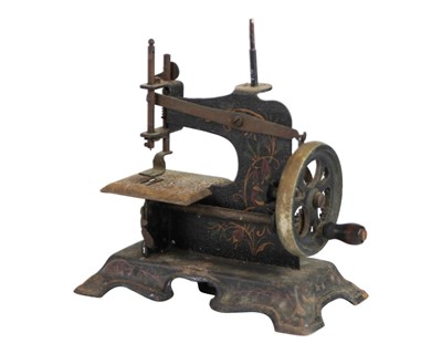 Lot 37 - Two miniature tinplate sewing machines.