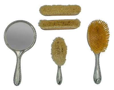 Lot 281 - A silver dressing table set by William Adams Ltd, and Robert Pringle & Sons.