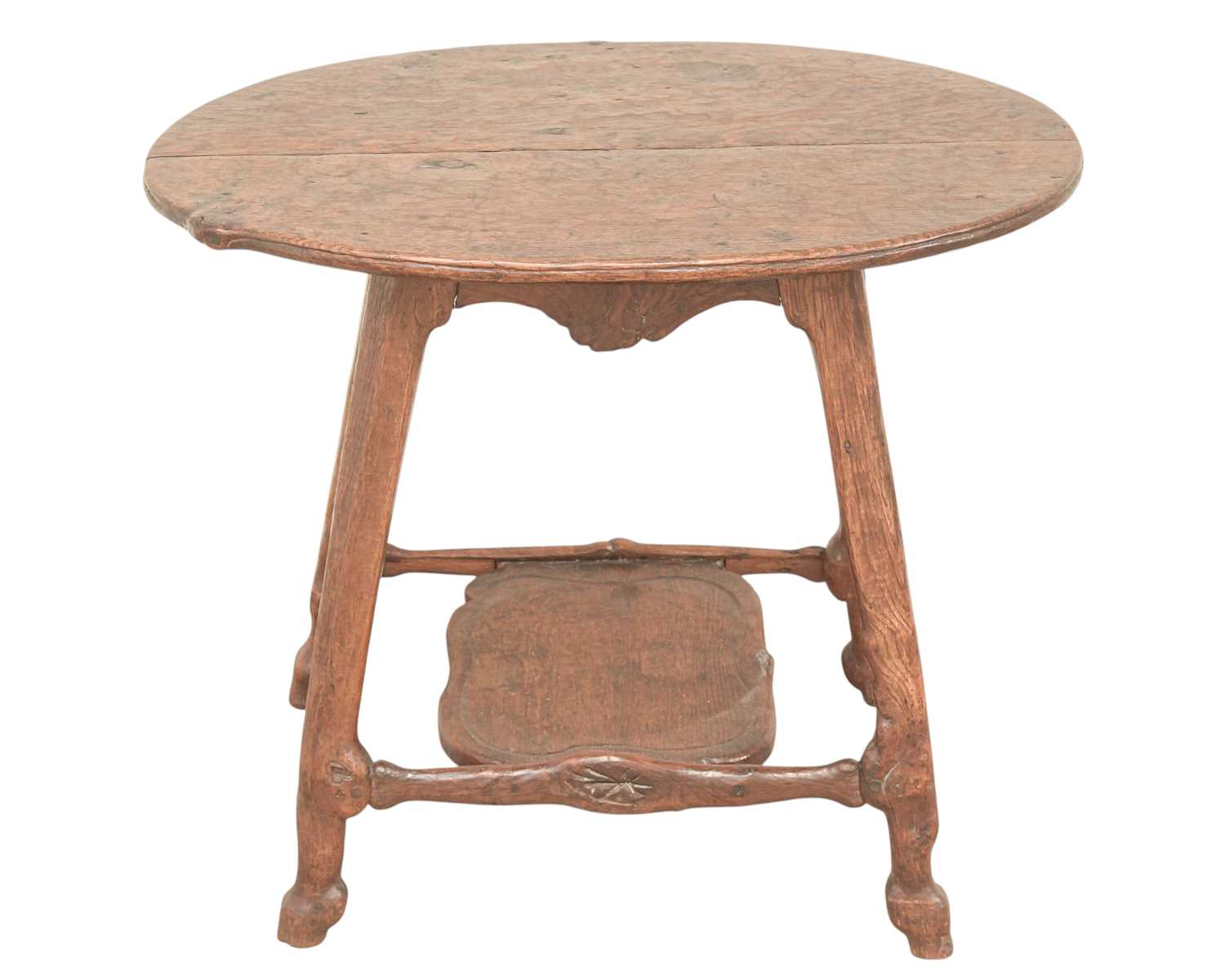 Lot 38 - An unusual carved oak two tier side table.