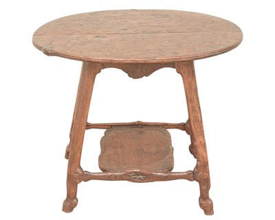 Lot 38 - An unusual carved oak two tier side table.