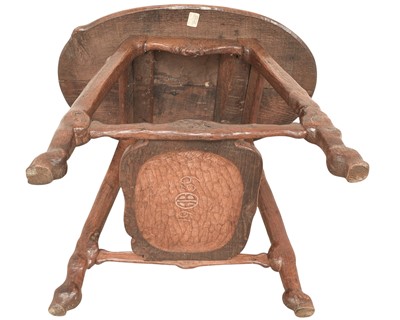 Lot 38 - An unusual carved oak two tier side table.