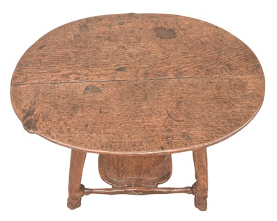 Lot 38 - An unusual carved oak two tier side table.