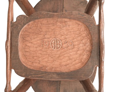 Lot 38 - An unusual carved oak two tier side table.
