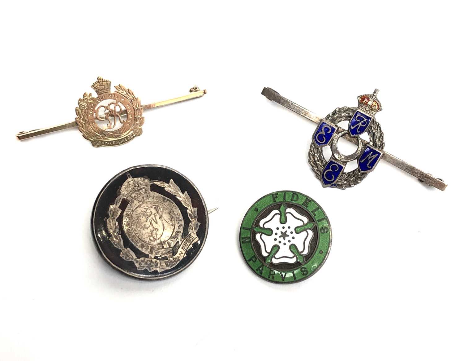 Lot 2329 - A 9ct gold Royal Engineers brooch and three