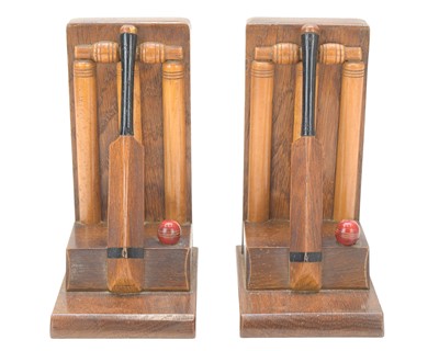 Lot 83 - A pair of cricket themed bookends.