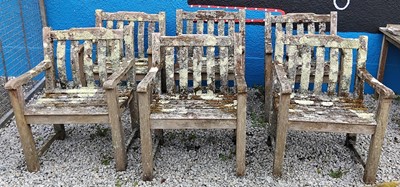 Lot 434 - A set of six weathered, lichen covered, teak garden chairs.
