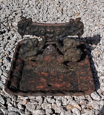 Lot 69 - A Victorian cast iron boot scraper.