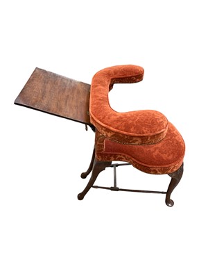Lot 826 - An early George III mahogany reading or cock fighting chair.