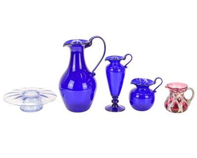 Lot 528 - A contemporary cranberry glass jug.