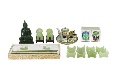 Lot 356 - A pair of Chinese green hardstone fo dog figures.