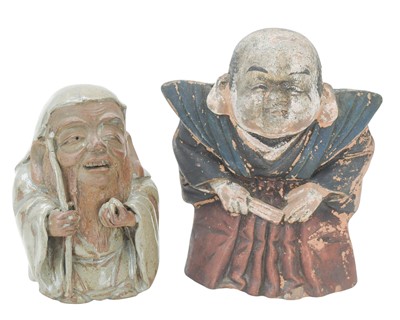 Lot 310 - A Japanese stoneware figure of an immortal.
