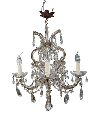 Lot 754 - A cut glass five arm chandelier.