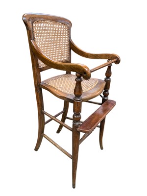 Lot 799 - A late Victorian stained beech and cane child's highchair.