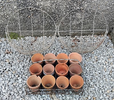 Lot 442 - A pair of French wire wall planters.