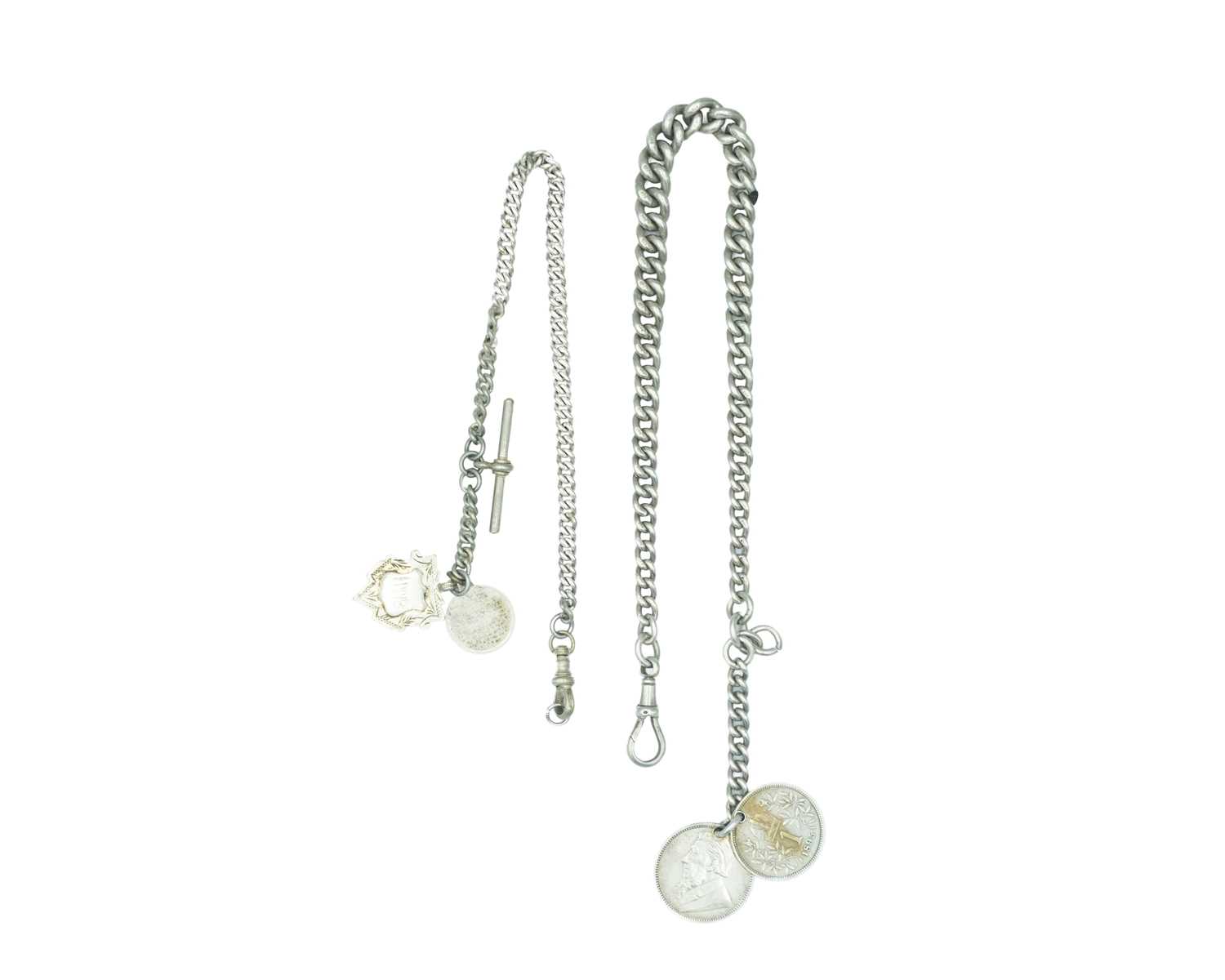 Lot 545 - A heavy silver Albert watch chain with two silver coin fobs.