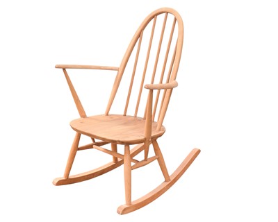Lot 201 - An Ercol beech and elm stick back rocking chair.