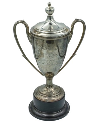Lot 210 - A George V silver lidded twin-handled trophy.