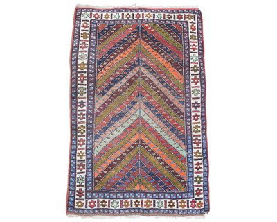 Lot 391 - A Kurdish rug, mid-late 20th century.