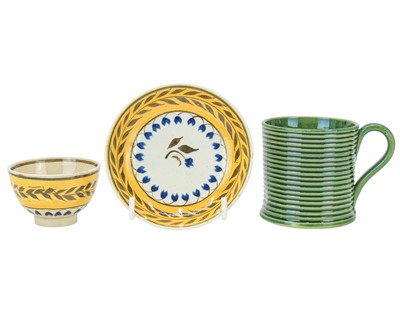 Lot 607 - A miniature Pratt type tea bowl and saucer.