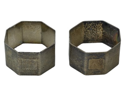 Lot 380 - A pair of silver napkin rings by William Neale & Son Ltd.