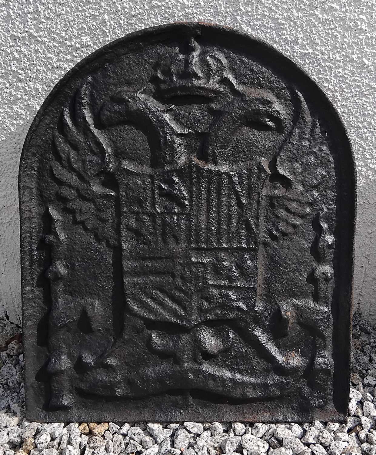 Lot 39 - An arched top cast iron fireback.