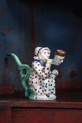 Lot 595 - A creamware Martha Gunn pipe.