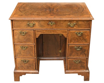 Lot 834 - A George II walnut kneehole desk or dressing table.