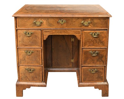 Lot 834 - A George II walnut kneehole desk or dressing table.