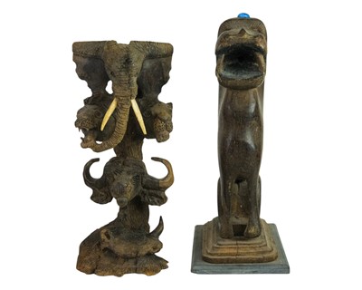 Lot 183 - An Indian carved hardwood figure of a lion or a tiger.