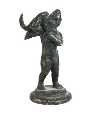 Lot 17 - A Grand tour type bronze figure of a cherub with a fish.