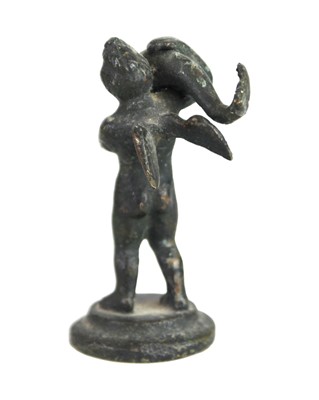 Lot 17 - A Grand tour type bronze figure of a cherub with a fish.