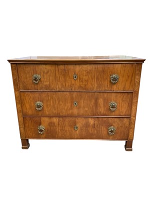 Lot 839 - A German walnut three drawer chest or commode.