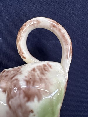 Lot 629 - A creamware Whieldon type cow creamer and cover.