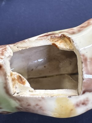 Lot 629 - A creamware Whieldon type cow creamer and cover.