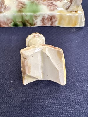 Lot 629 - A creamware Whieldon type cow creamer and cover.