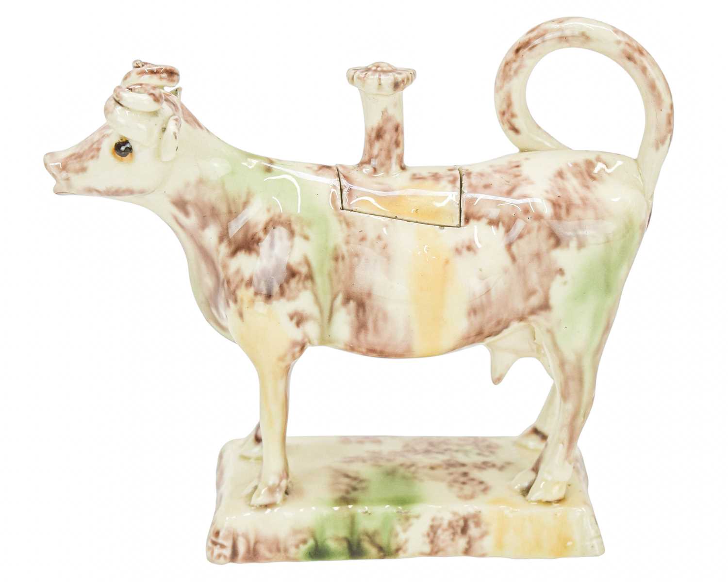 Lot 629 - A creamware Whieldon type cow creamer and cover.