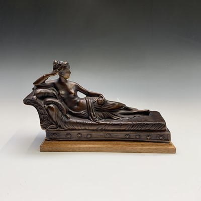 Lot 240 - A bronze sculpture of a female nude reclining...