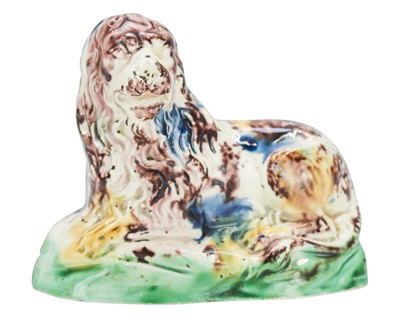 Lot 637 - A Whieldon type pottery figure of a lion.