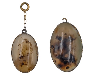 Lot 443 - Two Victorian dendritic agate pendants.