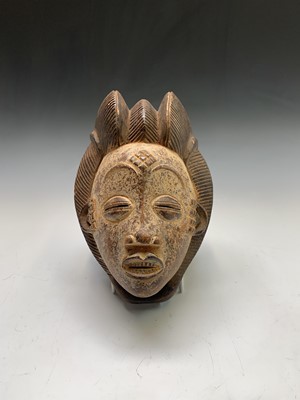 Lot 127 - An African carved wood mask, possibly Gabon,...