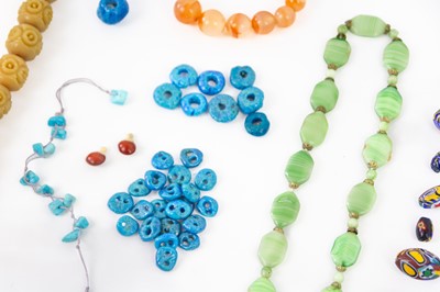Lot 386 - A selection of Persian faience donkey beads.