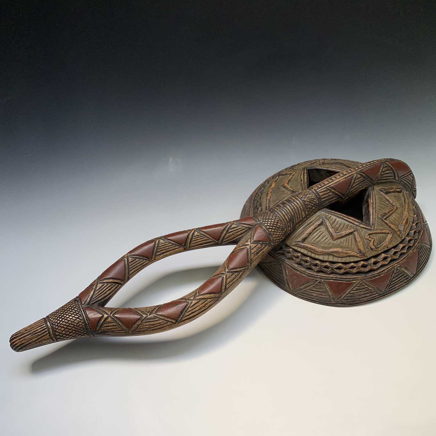 Lot 112 - A large tribal carved wood mask. Height 80cm.
