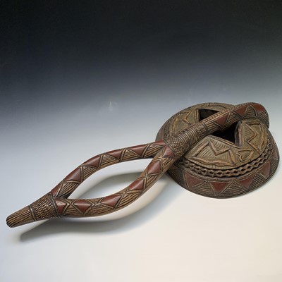 Lot 112 - A large tribal carved wood mask. Height 80cm.