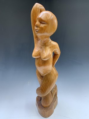 Lot 149 - A carved wood figure of a woman. Height 73cm.