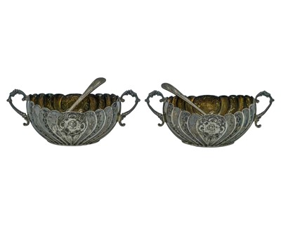 Lot 184 - A pair of Victorian silver condiment pots by the Atkin Brothers.