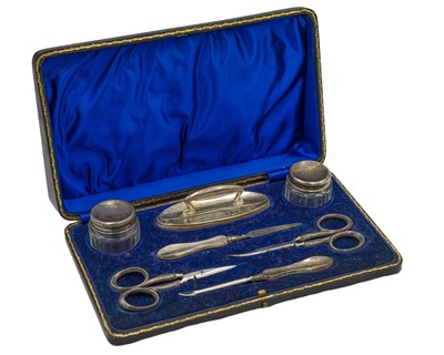 Lot 324 - A George V silver handled manicure set by W J Myatt & Co.